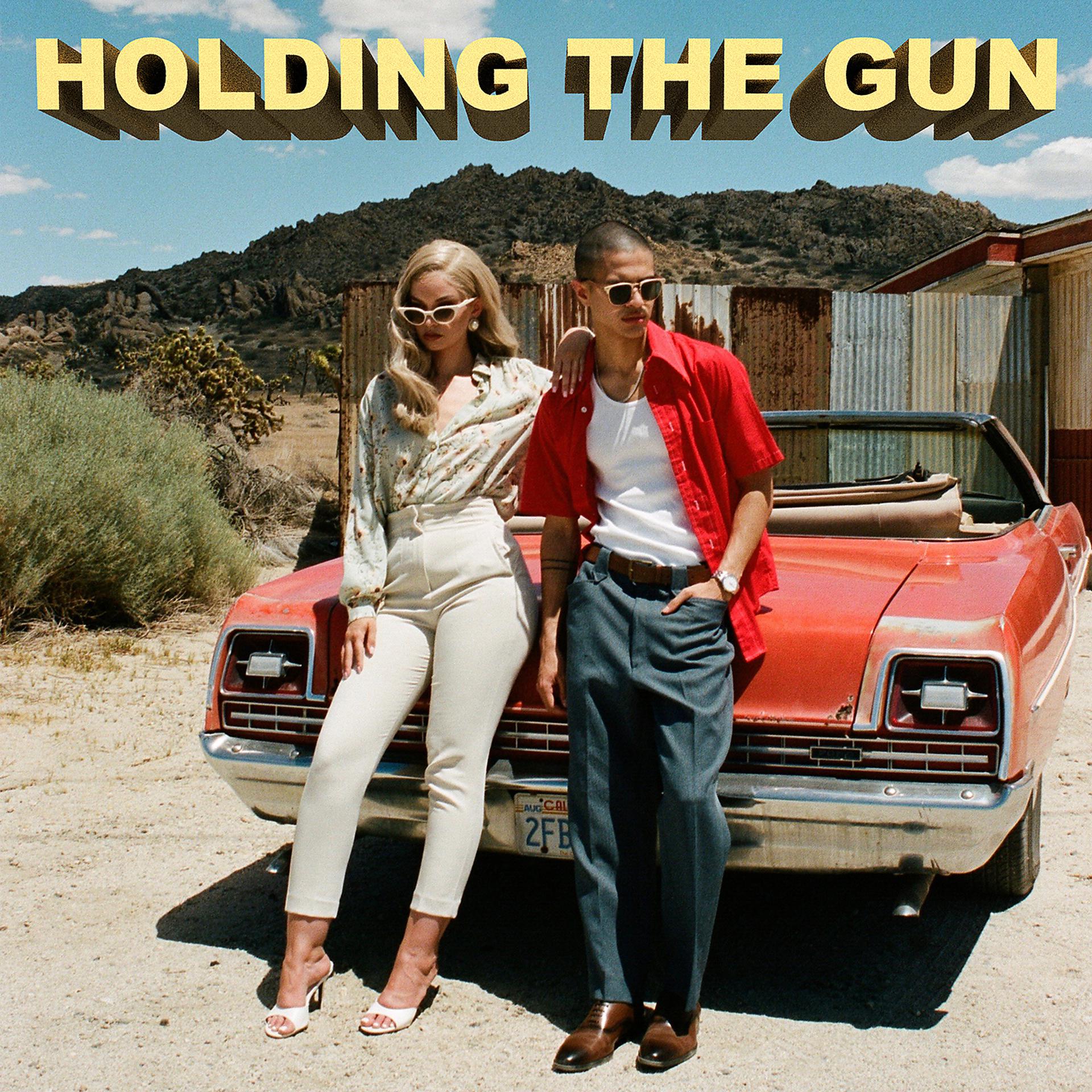 Постер альбома Holding the Gun